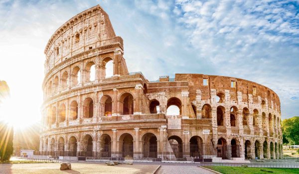 Colosseum in Rome and morning sun, Italy
